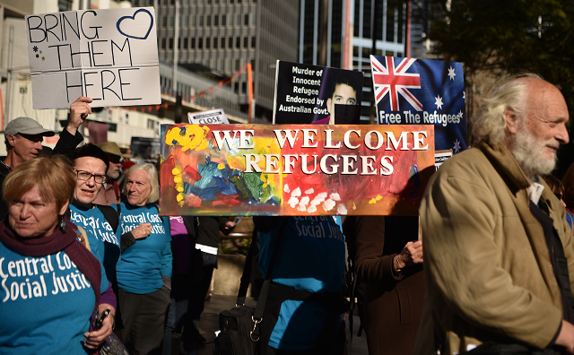 demonstrators march during a protest to demand humane treatment of asylum seekers and refugees in sydney photo afp