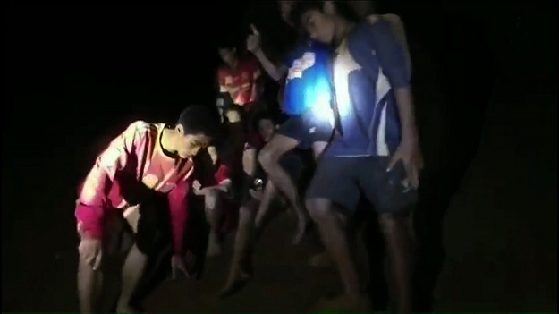 handout video grab taken from footage released by The Royal Thai Navy late July 2, 2018, shows missing children inside the Tham Luang cave of Khun Nam Nang Non Forest Park in the Mae Sai district of Chiang Rai province PHOTO:AFP