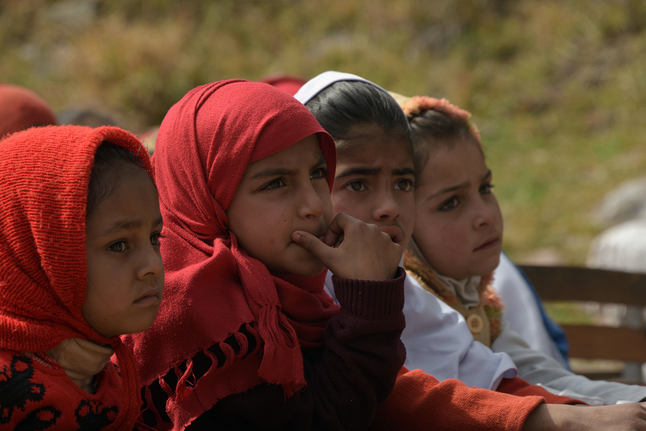 Students listen to a presentation by Red Cross Pakistan on landmines. PHOTO: AFP. 