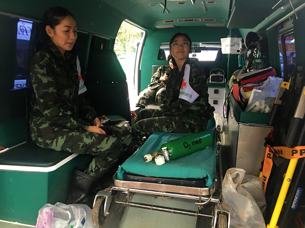 Medics wait in one of nine ambulances stationed outside the Tham Luang cave mouth. PHOTO:REUTERS