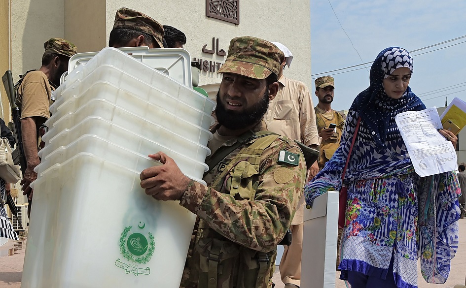 A Pakistani soldier carries ballot boxes at a distribution centre in Peshawar. PHOTO: AFP