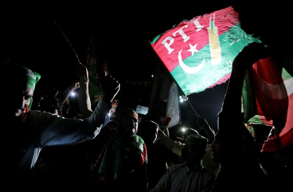 Supporters of Imran Khan, chairman of the Pakistan Tehreek-e-Insaf political party, celebrate near his residence in Bani Gala during the general election, in Islamabad, Pakistan July 25, 2018. PHOTO: REUTERS