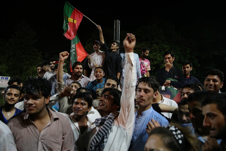 Supporters of Imran Khan, chairman of the Pakistan Tehreek-e-Insaf (PTI), political party celebrate during the general election in Islamabad, Pakistan, July 26, 2018. PHOTO: REUTERS