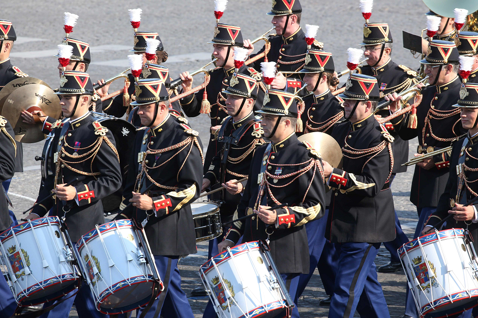 A military band of the French Republican Guard performs as it arrives for the annual Bastille Day military parade on the Champs-