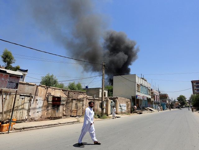 Smoke rises from an area where explosions and gunshots were heard, in Jalalabad city, Afghanistan July 31, 2018. PHOTO: REUTERS