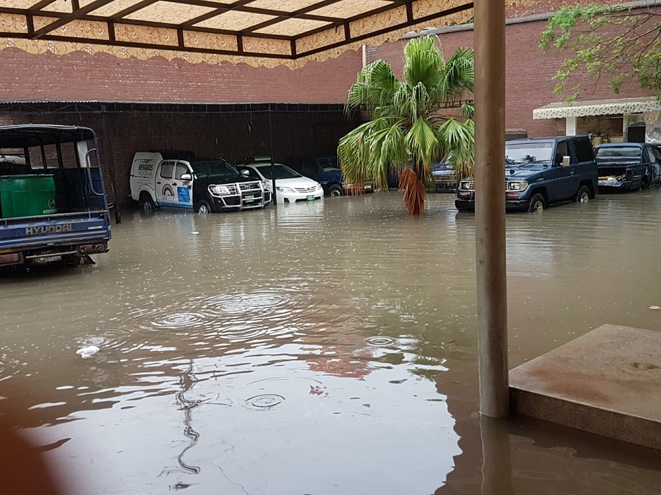 Cars parked in a flooded parking lot. PHOTO: EXPRESS/ M. Shehzad.
