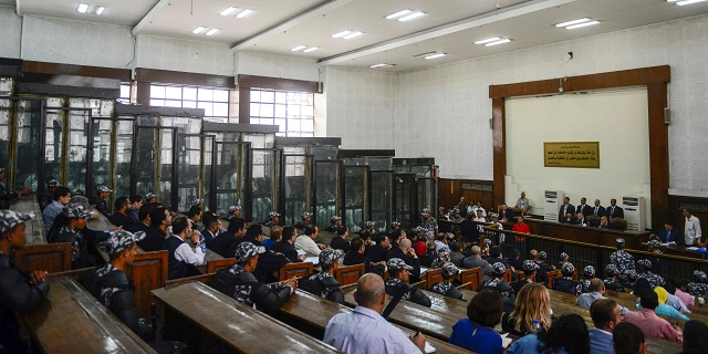 Members of Egypt's banned Muslim Brotherhood are seen inside a glass dock during their trial in the capital Cairo on July 28, 2018. PHOTO: REUTERS