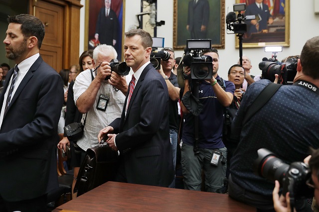 JULY 12: Deputy Assistant FBI Director Peter Strzok (C) arrives for a joint hearing of the House Judiciary and Oversight and Government Reform committees in the Rayburn House Office Building on Capitol Hill July 12, 2018 in Washington. PHOTO: AFP