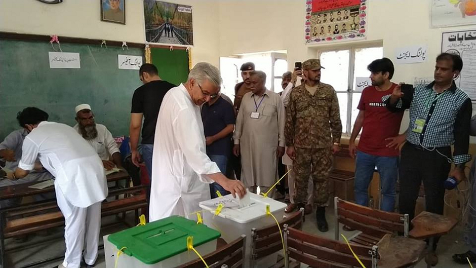 Former foreign minister Khawaja Asif casts vote at Sialkot NA-73 polling station. PHOTO: PML-N.