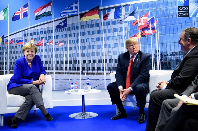 German Chancellor Angela Merkel (L) and US President Donald Trump (C) make a statement to the press, next to US Secretary of State Mike Pompeo (R) after a bilateral meeting on the sidelines of the NATO (North Atlantic Treaty Organization) summit at the NATO headquarters, in Brussels, on July 11, 2018. PHOTO: AFP