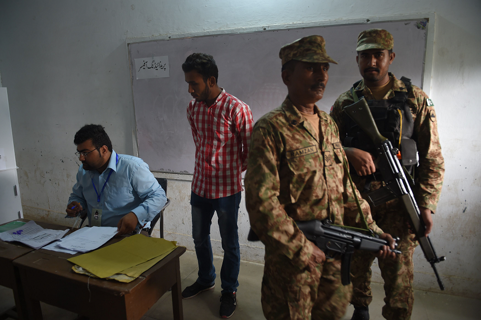 Soldiers at a polling station in Rawalpindi. PHOTO: AFP.