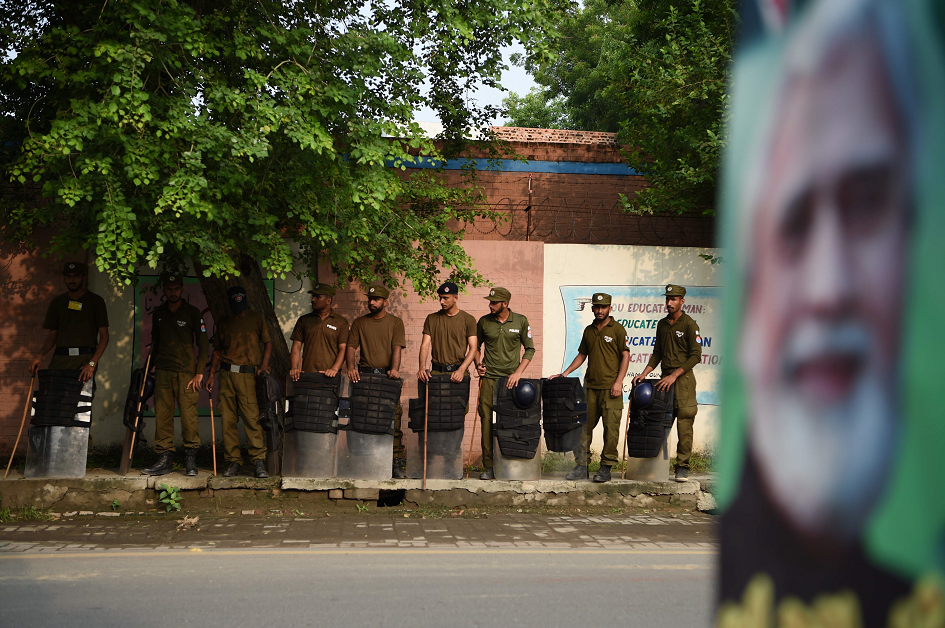 Pakistani soldiers stand outside a polling station. PHOTO: AFP.