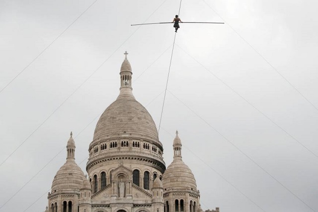 Tatian-Mosio Bongonga advances on a tightrope as she scales the Monmartre hill towards the Sacre Coeur Basilica in Paris on Saturday. PHOTO: REUTERS/ FILE