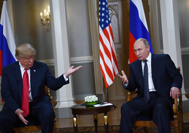 Russian President Vladimir Putin (R) and US President Donald Trump attend a meeting in Helsinki, on July 16, 2018. PHOTO: AFP