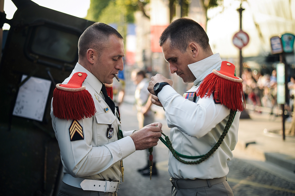 Soldiers of the 3rd regiment of the naval artillery corp prepare their uniforms for the annual Bastille Day military parade on the Champs-Elysees. PHOTO: AFP.