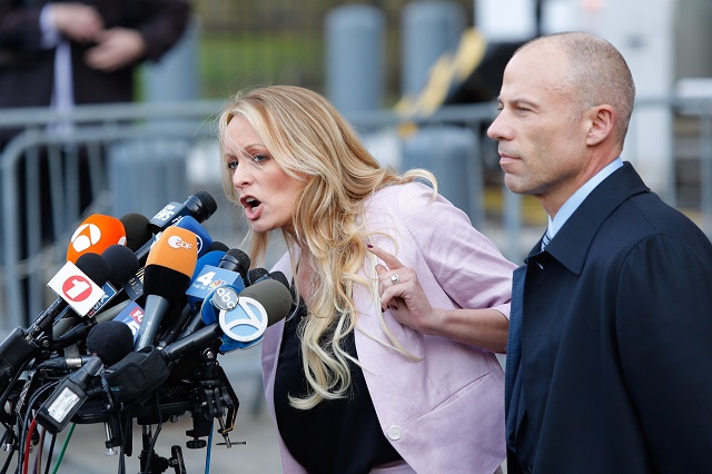  In this file photo taken on April 16, 2018 adult-film actress Stephanie Clifford, also known as Stormy Daniels, speaks US Federal Court with her lawyer Michael Avenatti (R) in Lower Manhattan, New York. PHOTO: AFP