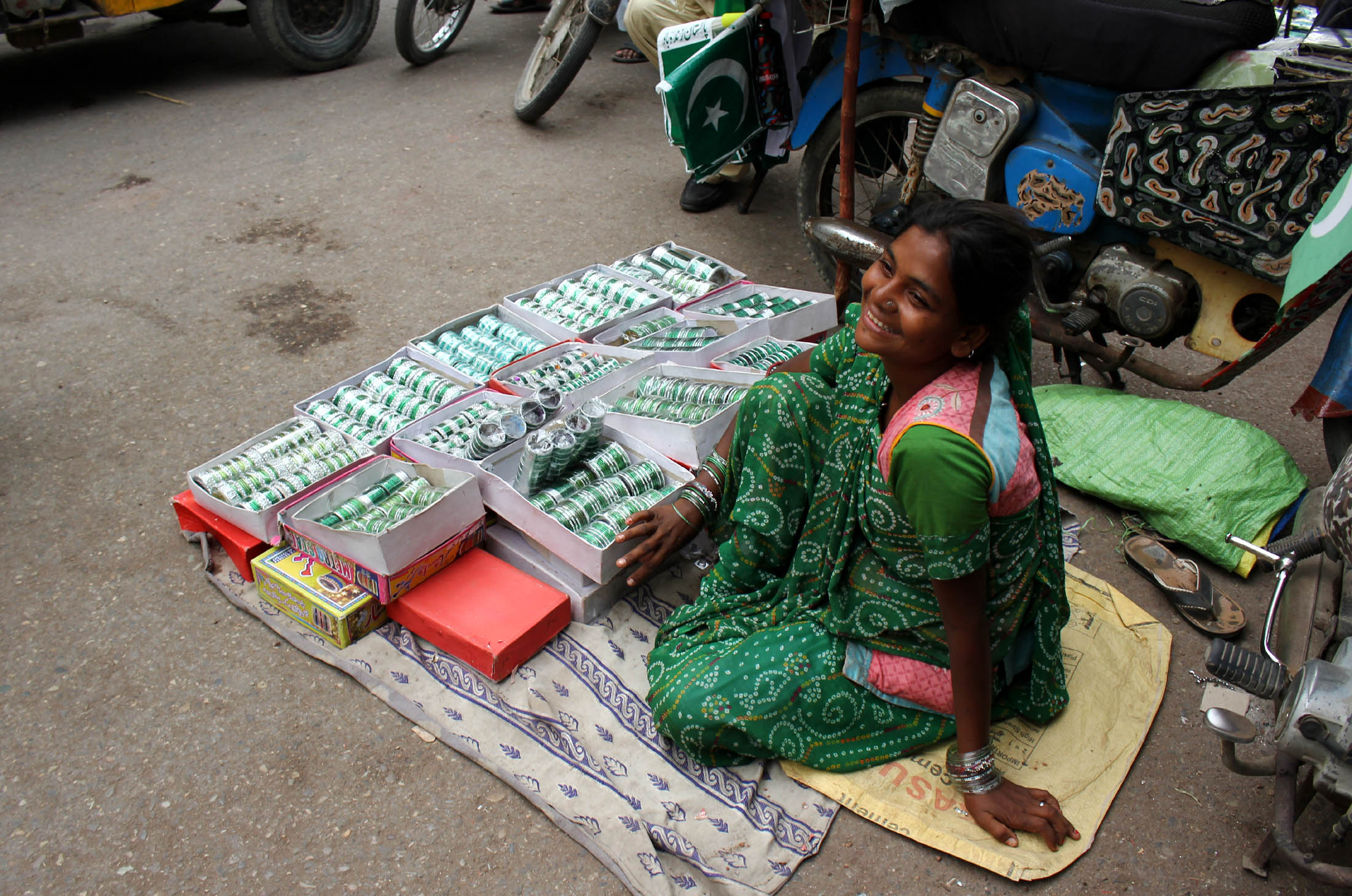 a hindu salesman asha selling white and green bangles for independence day at paper market photo athar khan