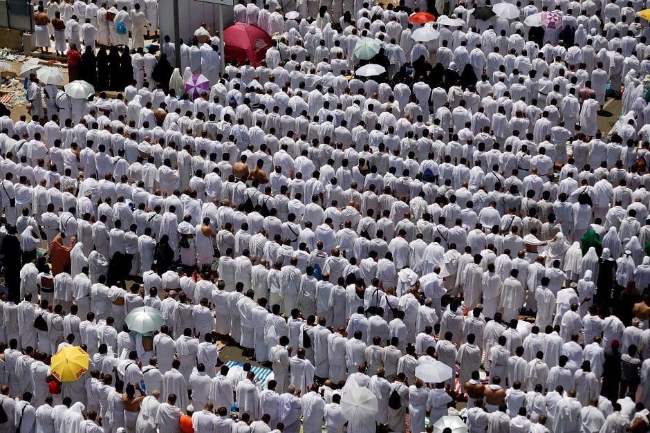 Pilgrims pray outside Namira Mosque on the plains of Arafat during Hajj on August 20,2018. PHOTO:REUTERS