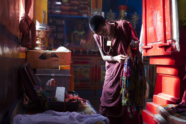 Buddhist monk works inside Komik monastery. PHOTO: AFP