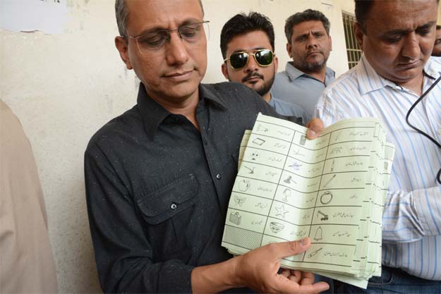 PPP leader Saeed Ghani with the ballot papers. PHOTO: EXPRESS