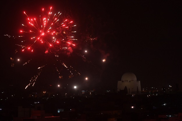 Fireworks are seen over Karachi as part of Independence Day celebrations on August 14, 2018. - Pakistan on August 14 celebrated its 71st anniversary of the country's independence from British rule. PHOTO: AFP
