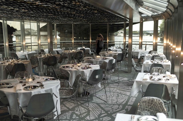 Dressed tables are seen at French chef Alain Ducasse's new boat restaurant, the 