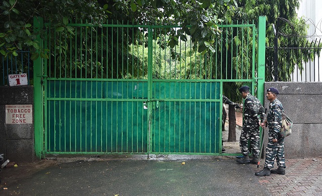 Indian security forces stand outside the government school where a seven years old girl student was sexually assaulted, in New Delhi on August 10, 2018. PHOTO: REUTERS