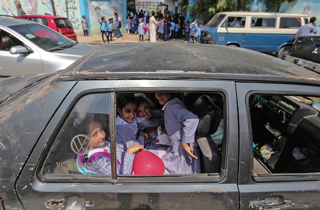 Pupils are transported to a school run by the United Nations Agency for Palestinian Refugees (UNRWA) in Gaza City on August 29, 2018. PHOTO: AFP