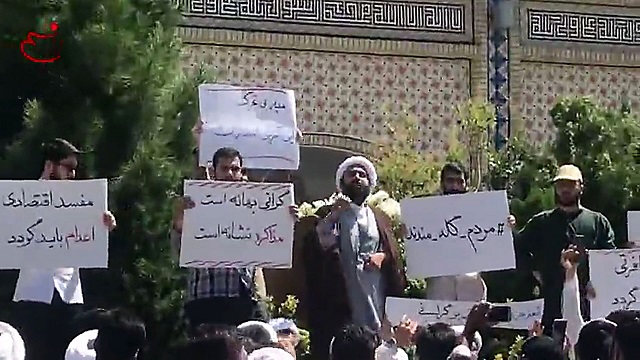 In this video grab made from a video by Nasim News Agency, a cleric speaks to a crowd of protesters demonstrating in Mashhad, in the Khorasan Razavi province, on August 3, 2018. PHOTO: AFP