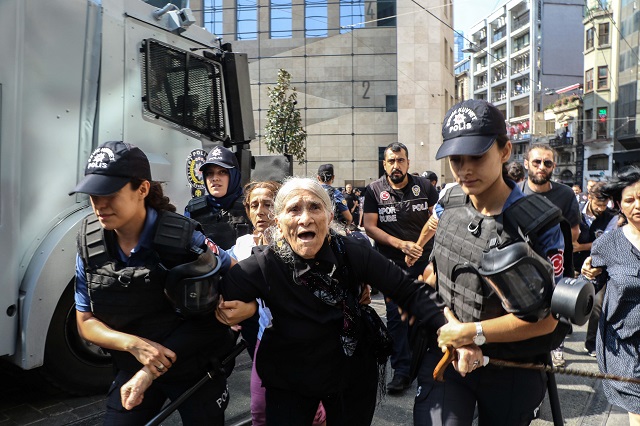 Emine Ocak, a a member of Saturday Mothers Turkish group is detained by Turkish female riot police during a demonstration on August 25, 2018 in Istanbul. PHOTO: AFP
