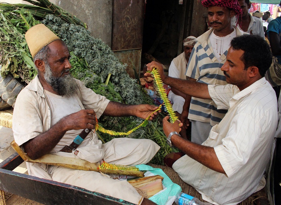 Vendors make garlands for decoration in the Northern district of Abs in Yemen's Hajjah province on August 16, 2018, ahead of Eidul Azha. PHOTO:AFP