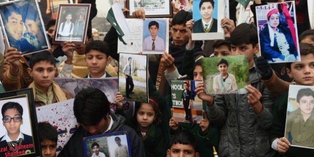 Relatives of schoolchildren killed in a Taliban attack on the Army Public School (APS) protest against delays in the investigation in Peshawar. PHOTO: AFP