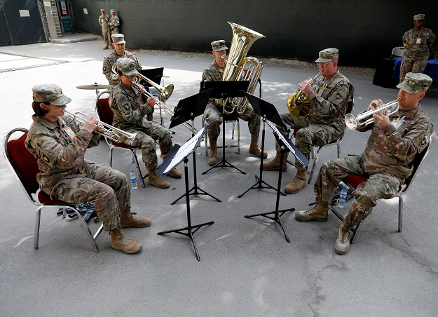 US troops play music during a change of command ceremony in Resolute Support headquarters in Kabul. PHOTO:REUTERS