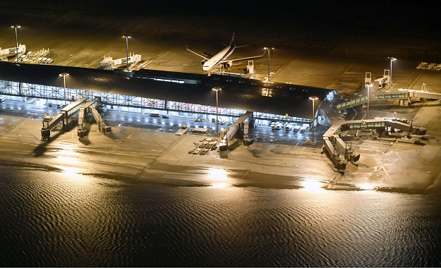 An aerial view shows a flooded runway at Kansai airport, which is built on a man-made island in a bay, after Typhoon Jebi hit the area. PHOTO:REUTERS