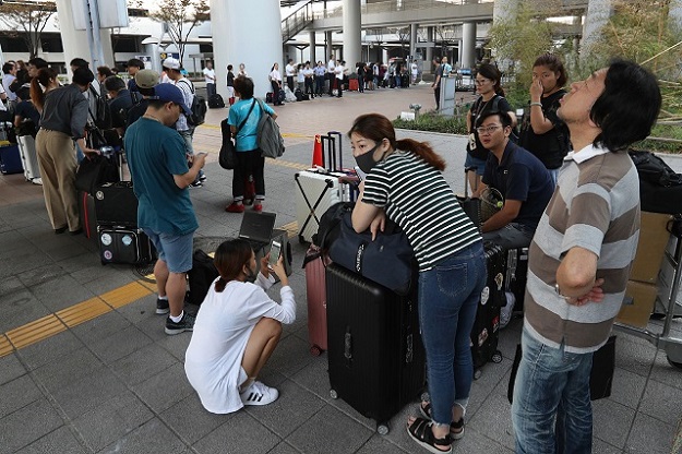 Passengers stranded at the Kansai International Airport PHOTO: AFP