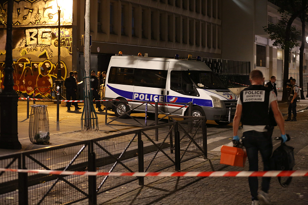 French police is on the scene where a man attacked and injured people with a knife in the streets of Paris. PHOTO: AFP