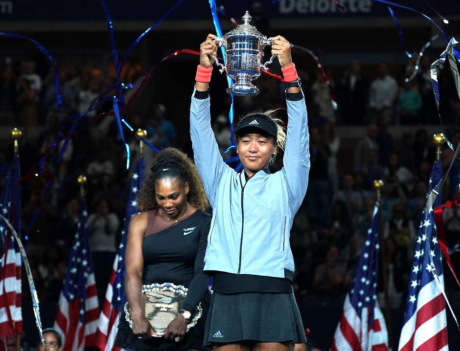 Naomi Osaka holds the US Open Womens Single champion trophy after defeating Serena Williams of the US during their Women's Singles Finals match at the 2018 US Open at the USTA Billie Jean King National Tennis Center in New York on September 8, 2018. PHOTO: AFP