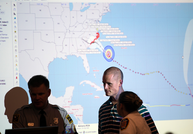 Emergency workers monitor hurricane progress and prepare for the landing at the Emergency operations center a day before the arrival of hurricane Florence in Wilmington. PHOTO:AFP