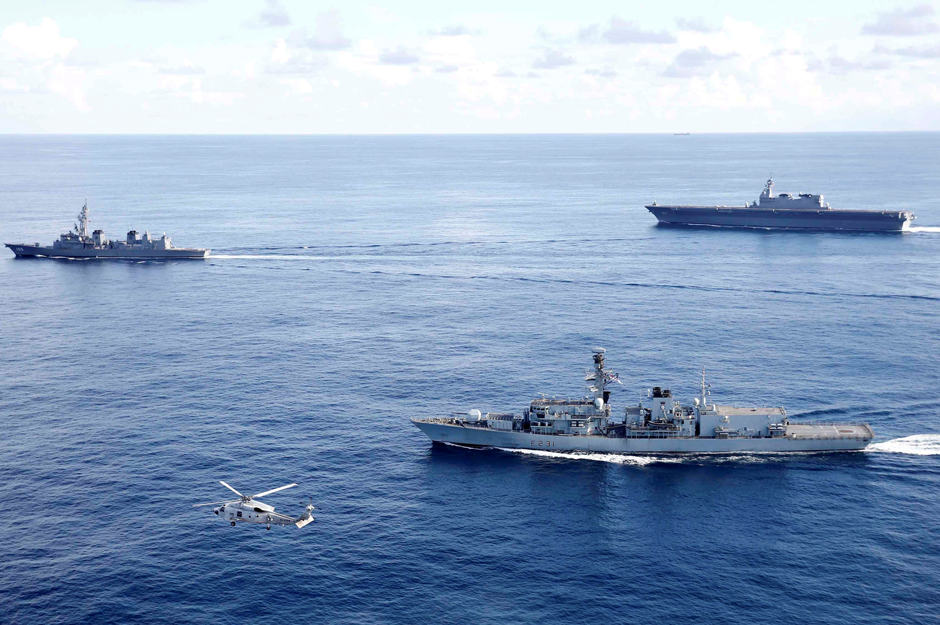 British frigate HMS Argyll (front), Japanese destroyer Inazuma (L) and Japanese helicopter carrier Kaga take part in a joint naval drill in the Indian Ocean. Reuters 