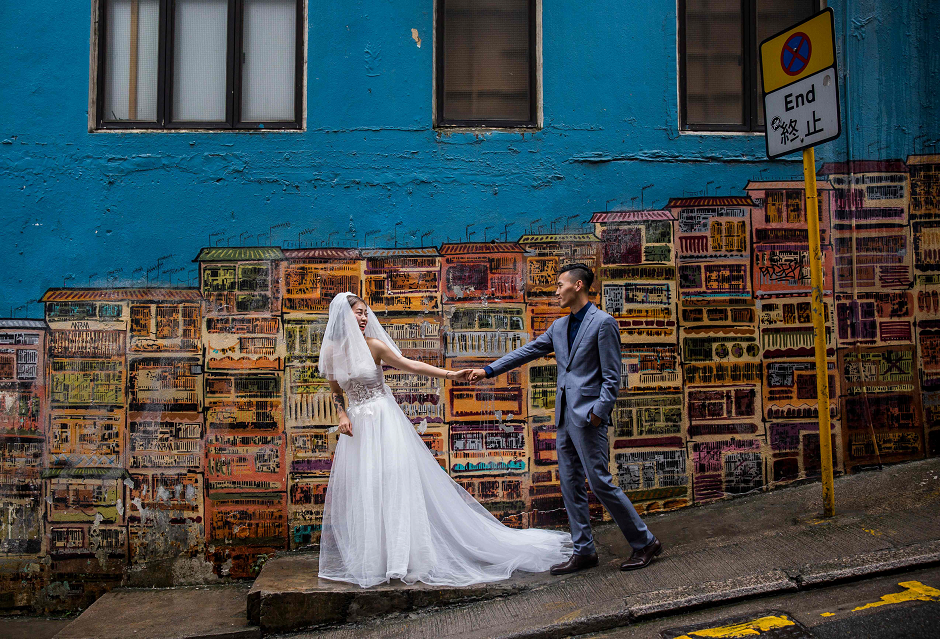 A couple pose for wedding photos in the Central district of Hong Kong  AFP