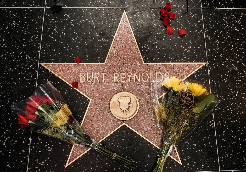 Flowers are seen on actor Burt Reynold's star on the Hollywood Walk of Fame on September 6, 2018 in Los Angeles, California. Reynolds died today at 82 years old. PHOTO: AFP