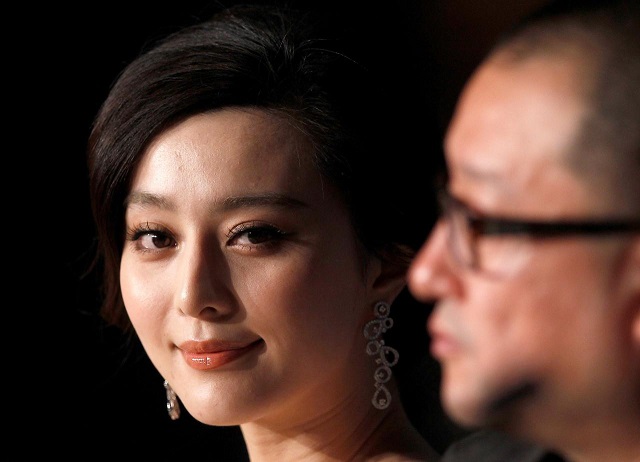 Director Wang Xiaoshuai (R) and cast member Fan Bingbing attend a news conference for the film 