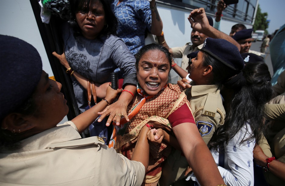 7.Police detain activists of India's main opposition Congress Party during a protest, demanding total waiver of agricultural loans in Gandhinagar, India. PHOTO: REUTERS