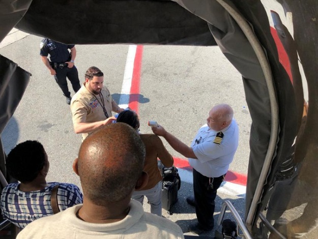 Passengers leave the plane being assisted by the air cabin crew and the emergency services on a flight from New York to Dubai, on JFK Airport, New York, US, September 05, 2018 in this still image obtained from social media. PHOTO:REUTERS VIA THIRD PARTY