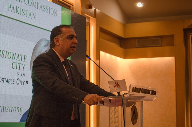 Governor Sindh Imran Ismail speaks after talk by Karen Armstrong. PHOTO: EXPRESS