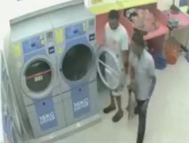CCTV footage from the laundrette shows the men putting the cat in the dryer and turning the machine on. SCREENGRAB