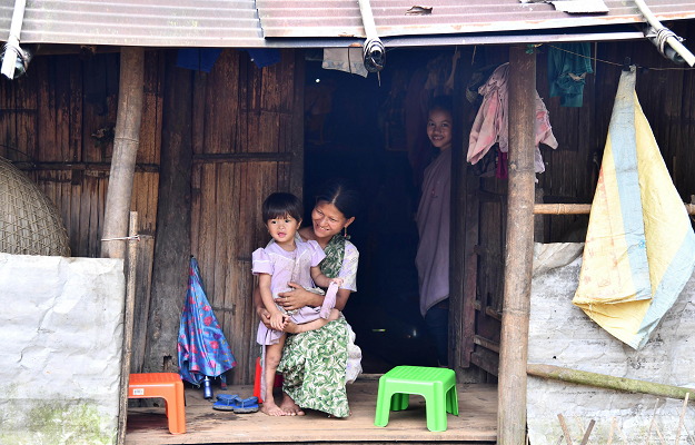 Pyndaplin Shabong, 39, with her daughter at her house in Kongthong village. PHOTO: AFP 