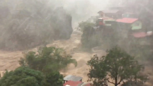  Raging floods water is seen in Baguio City as Typhoon Mangkhut, known locally as Ompong, hit the Philippines, in this still image obtained from a September 15, 2018 social media video. PHOTO: REUTERS