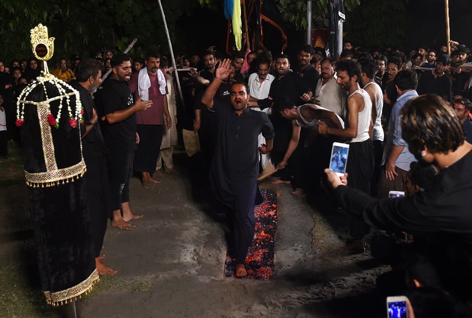 Shia Muslims walk on burning coals during the first ten days of Muharram in Lahore on September 19, 2018. PHOTO:AFP