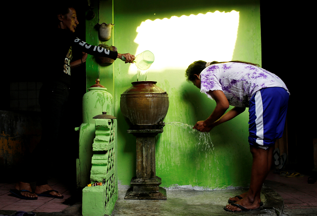 transgender women wash and clean themselves before prayer in yogyakarta indonesia photo reuters